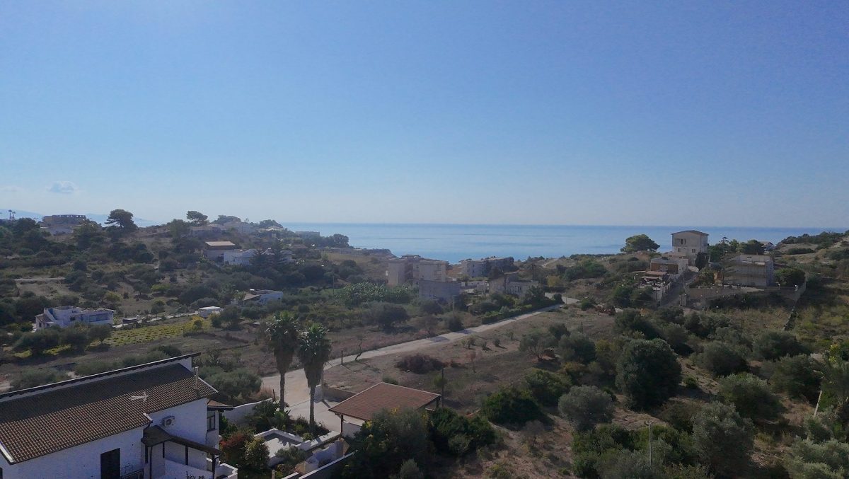 The countryside around the villa, with the sea on the horizon