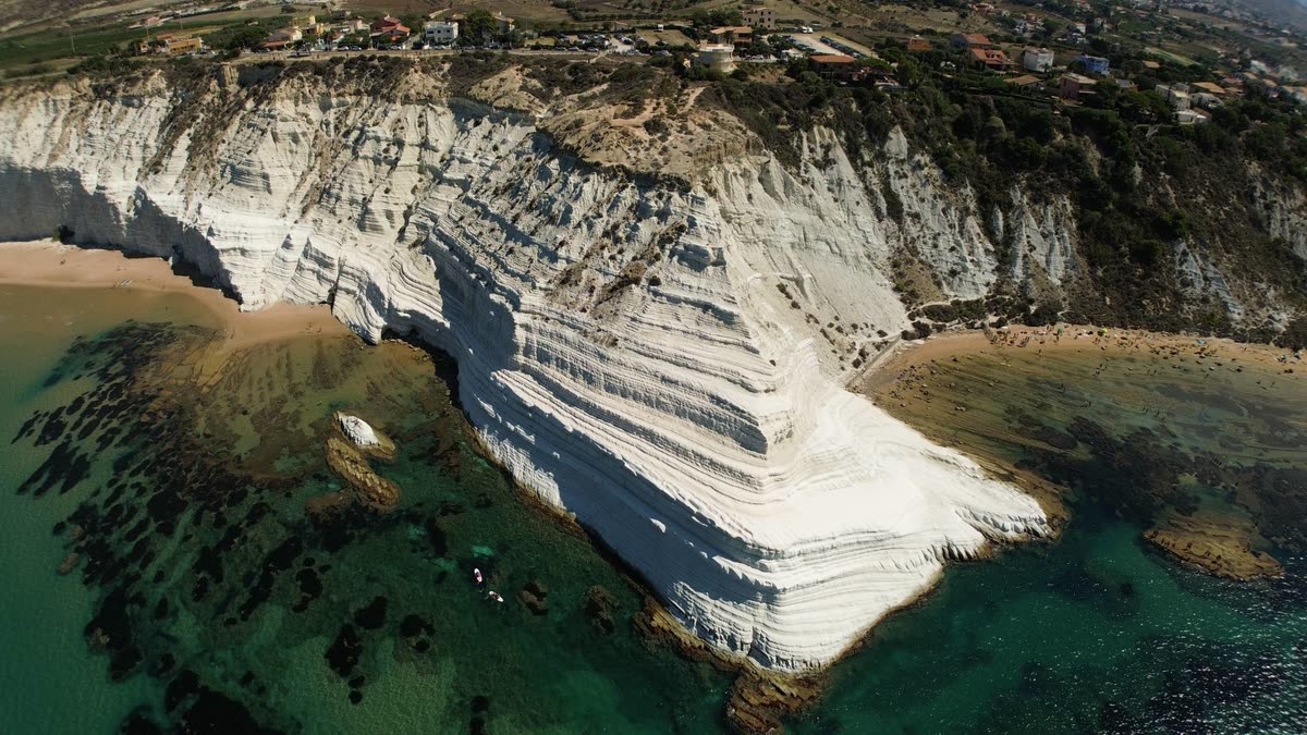 Scala dei Turchi from above: the stepped white cliff and the turquoise sea