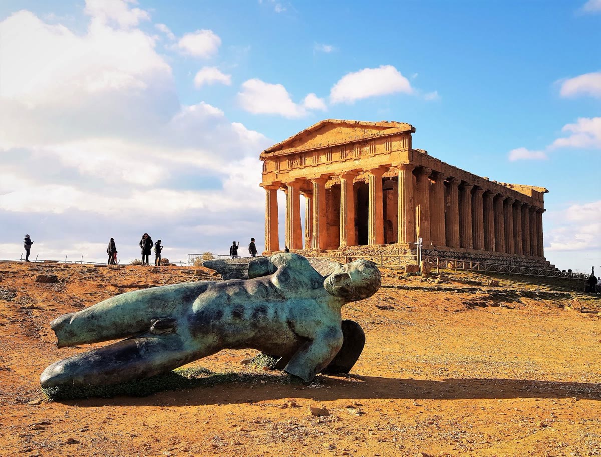 The Temple of Concord in the Valley of the Temples, with the bronze fallen Icarus statue in the foreground