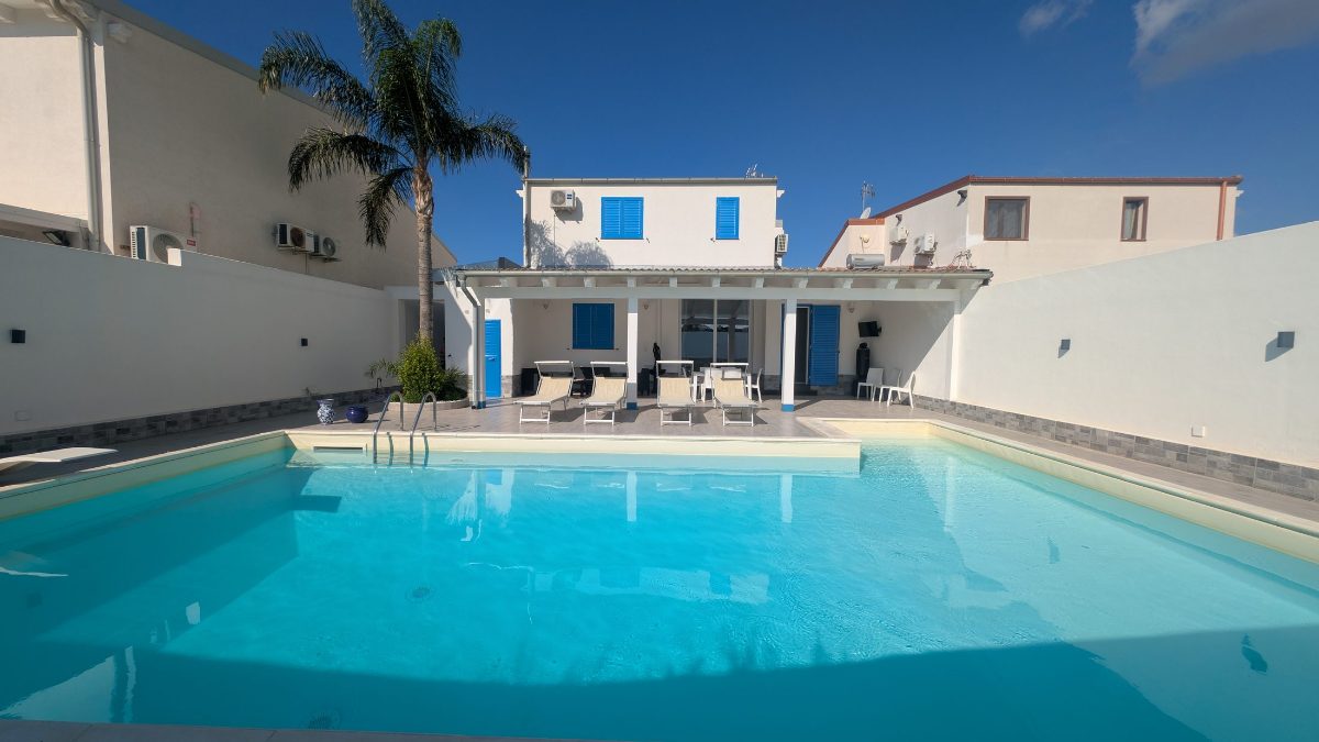 The whole private pool, with sun loungers at the far end